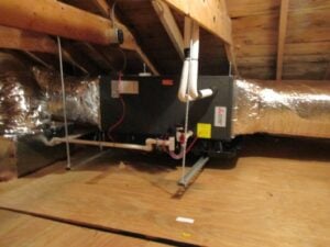 A Mitsubishi Electric air handler installed in a home in Andover for a hybrid HVAC system.