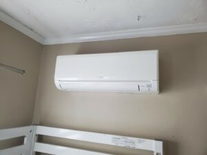 A Mitsubishi ductless wall-mounted unit installed in one of the bedrooms.