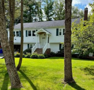 This Lexington, MA, split-entry home upgrades its living room window AC with Mitsubishi ductless.