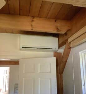 A wall-mounted Mitsubishi ductless MSZ-GL unit in the bedroom of this farmhouse in Sherborn, MA. 