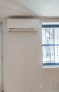 A Mitsubishi Electric ductless wall unit installed for heating and cooling this Brownstone in Boston, MA.