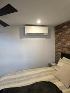A Mitsubishi Electric ductless wall unit installed in a Boston Brownstone condo for heating and cooling.