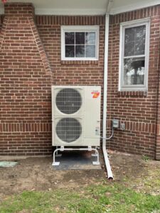 The Mitsubishi Electric outdoor condenser was installed outside Arlington, MA, home.