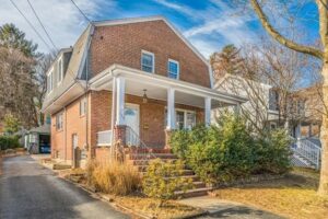 This Arlington, MA, home upgrades forced hot water system for hybrid ductless heating and cooling. 