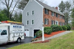 Colonial home in North Andover, MA, had a whole home ductless ac installation to replace an oil system. 