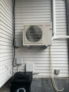 Outdoor heat pump condenser unit for a condo in Boston, MA.