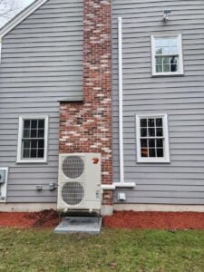 Outdoor heat pump condenser unit for colonial home in North Andover, MA.