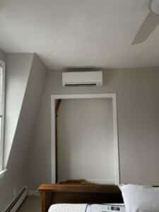 Wall-mounted mini-split air conditioner in a MA condo.