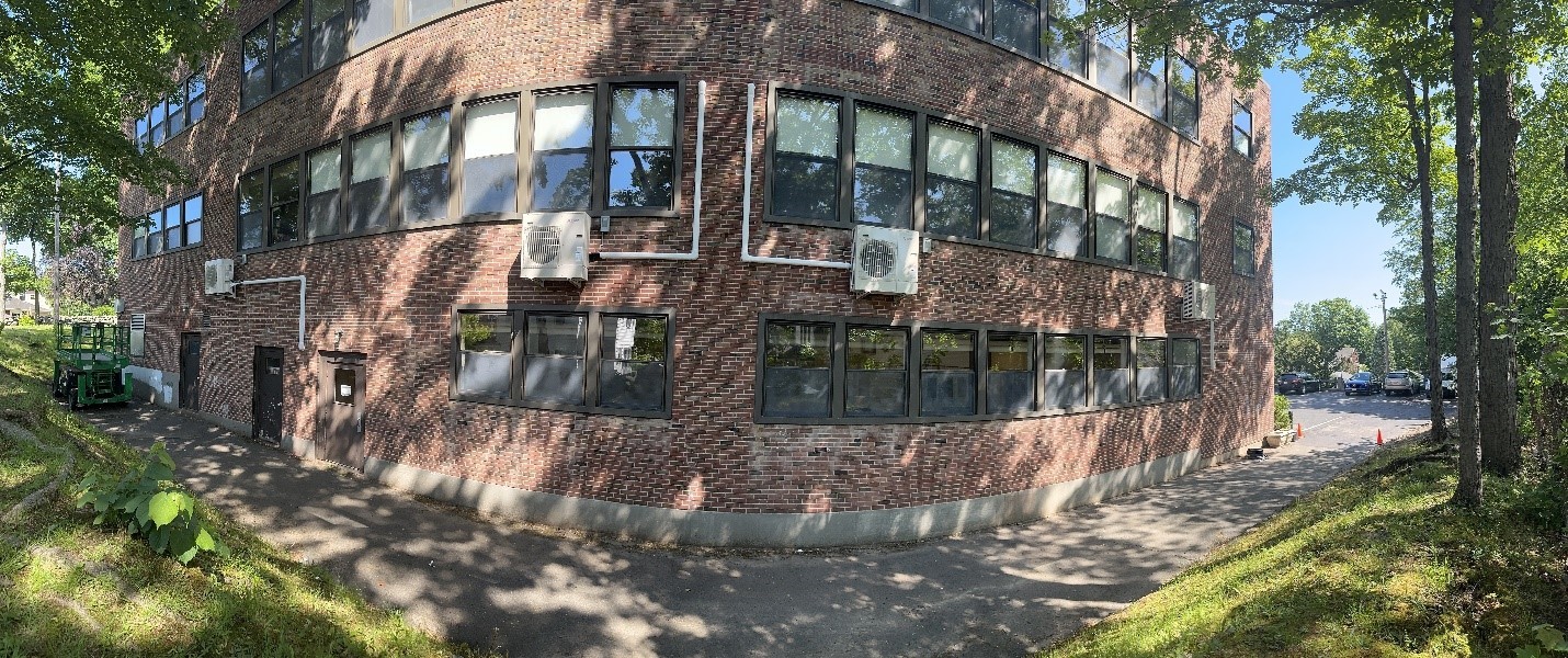 Four of the outdoor heat pumps for Parish School in Reading, MA.