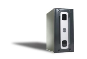 A black and silver tower computer server is positioned on a white background, casting a shadow to the left.