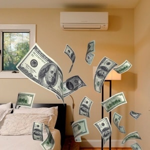 Several U.S. hundred-dollar bills appear to be floating in the air inside a modern bedroom with beige walls and minimal decor.