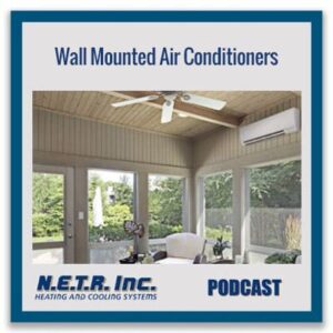 A sunroom with a ceiling fan and a wall-mounted air conditioner, featuring large windows overlooking a garden. Text reads: "Wall Mounted Air Conditioners - N.E.T.R. Inc. Podcast.