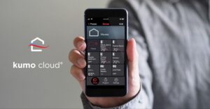 A person holds a smartphone displaying a home automation app with labeled zones and temperature controls; the kumo cloud logo is visible on the left.